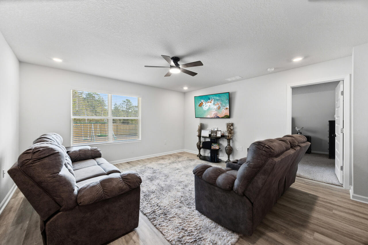 3411 Phoenix Court Crestview, FL 32539 - Photo 6 of 47 a living room with furniture and a large window