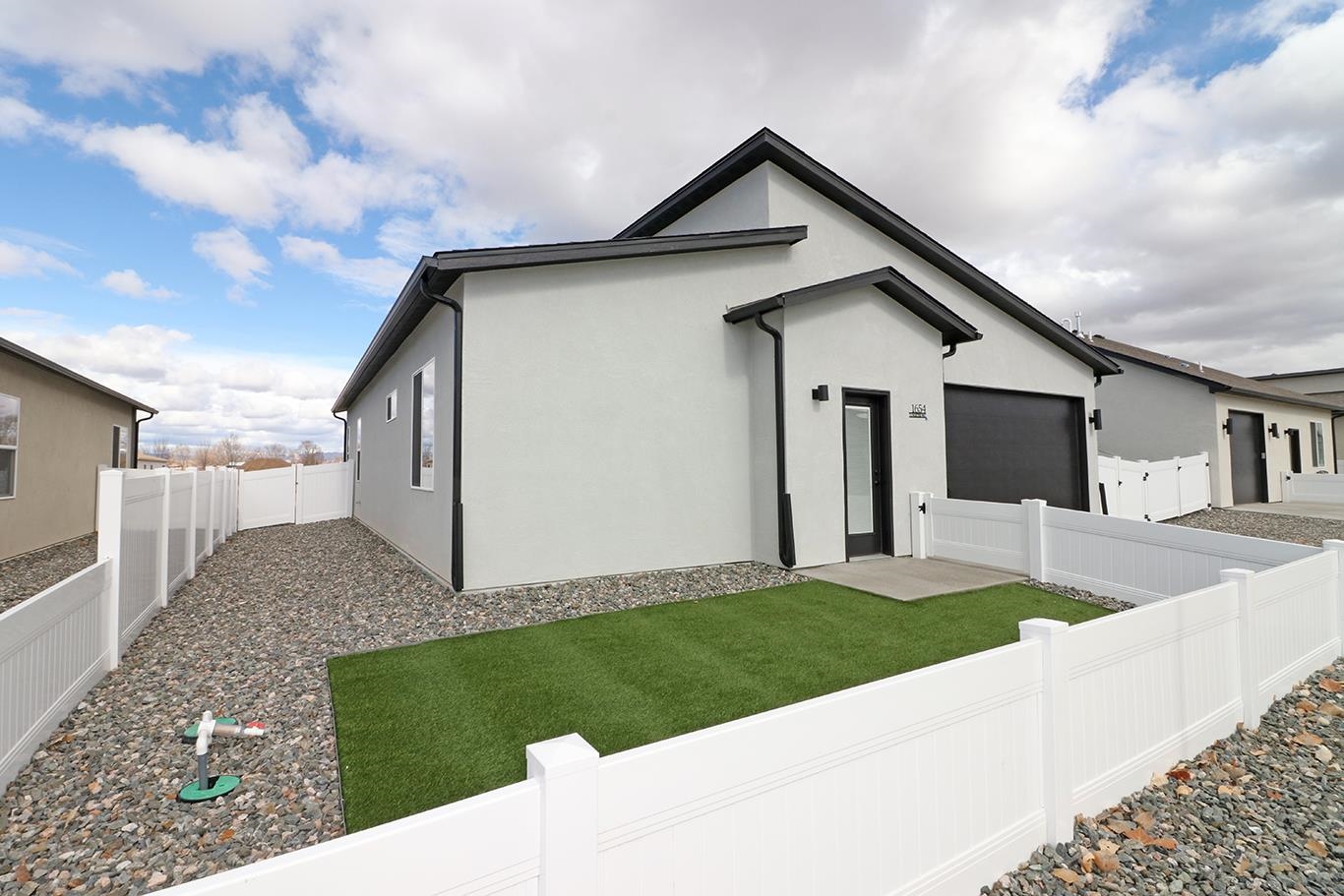 1654 Tungsten Way Fruita, CO 81521 - Photo 3 of 22 a front view of a house with a yard
