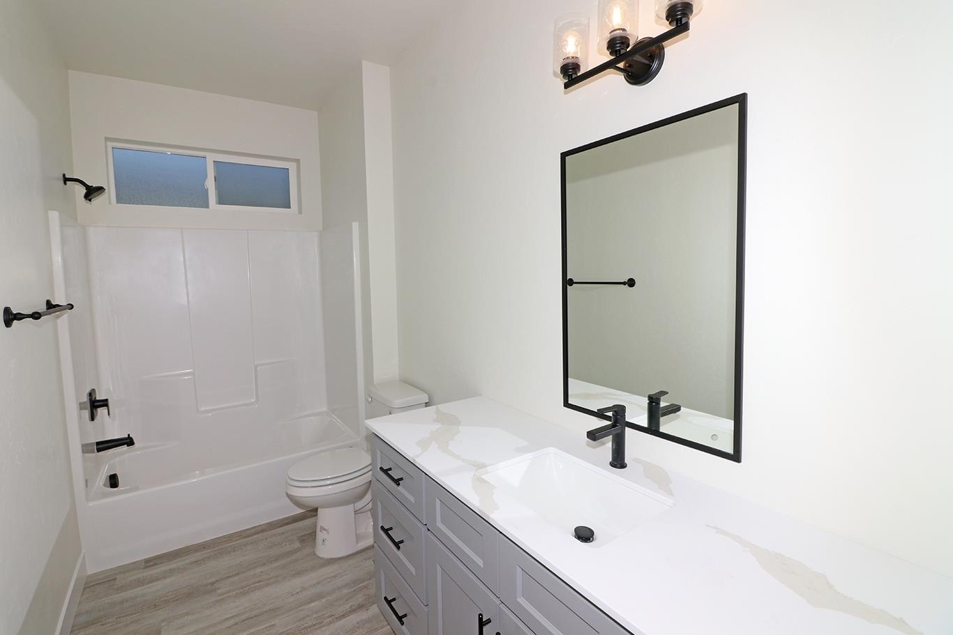1654 Tungsten Way Fruita, CO 81521 - Photo 9 of 22 a bathroom with a sink a toilet and shower