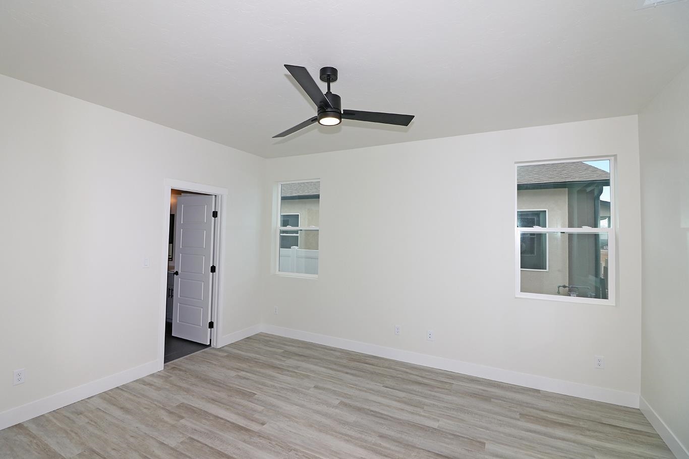 1654 Tungsten Way Fruita, CO 81521 - Photo 10 of 22 a view of empty room with wooden floor