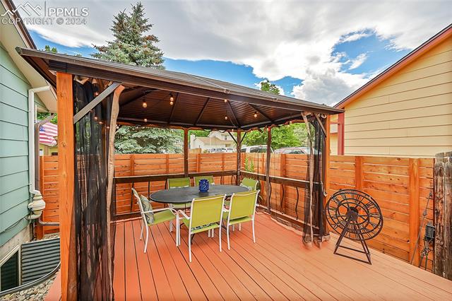 5255 Pinon Valley Road Colorado Springs, CO 80919 - Photo 37 of 47 Wooden deck featuring a gazebo
