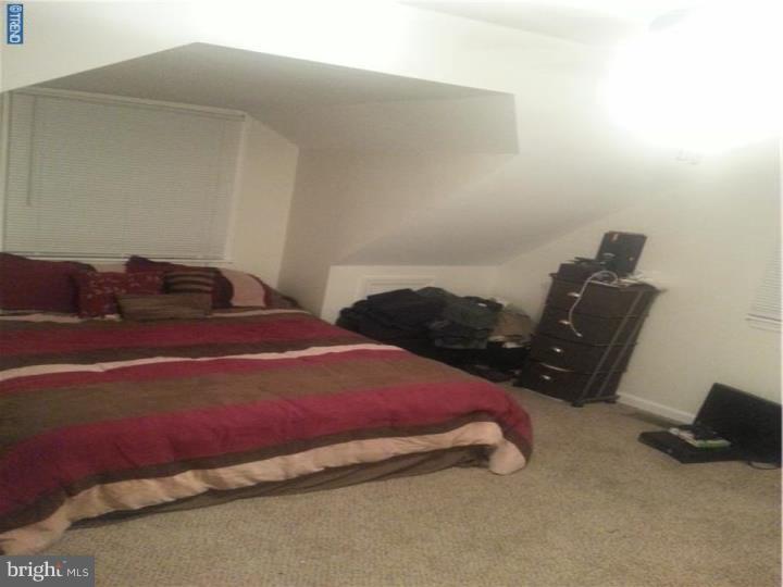 8 Collins Road Hamilton, NJ 08619 - Photo 15 of 23 a bedroom with a bed and lamp