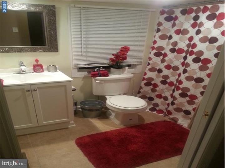 8 Collins Road Hamilton, NJ 08619 - Photo 16 of 23 a bathroom with a sink toilet and mirror