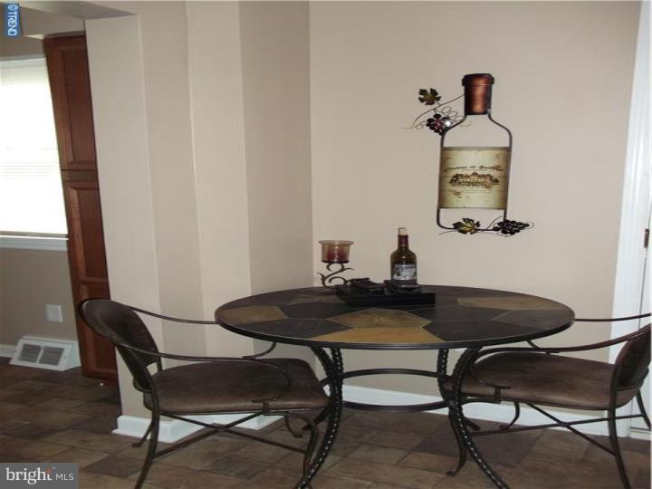 8 Collins Road Hamilton, NJ 08619 - Photo 4 of 23 a table and chairs in a room