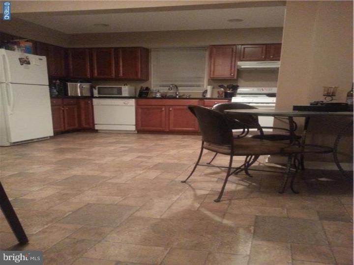 8 Collins Road Hamilton, NJ 08619 - Photo 7 of 23 a kitchen with stainless steel appliances a stove a sink a microwave and a refrigerator