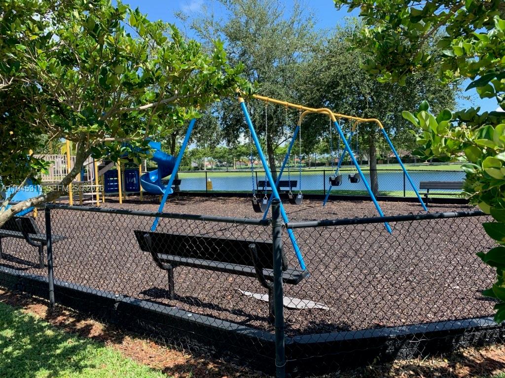 9260 Southwest 220th Street Cutler Bay, FL 33190 - Photo 19 of 20 a view of a park with iron fence