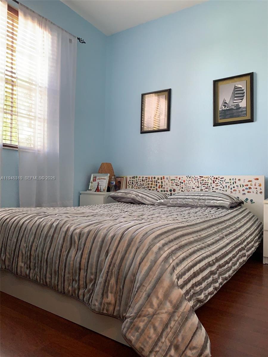9260 Southwest 220th Street Cutler Bay, FL 33190 - Photo 8 of 20 a bedroom with bed and window