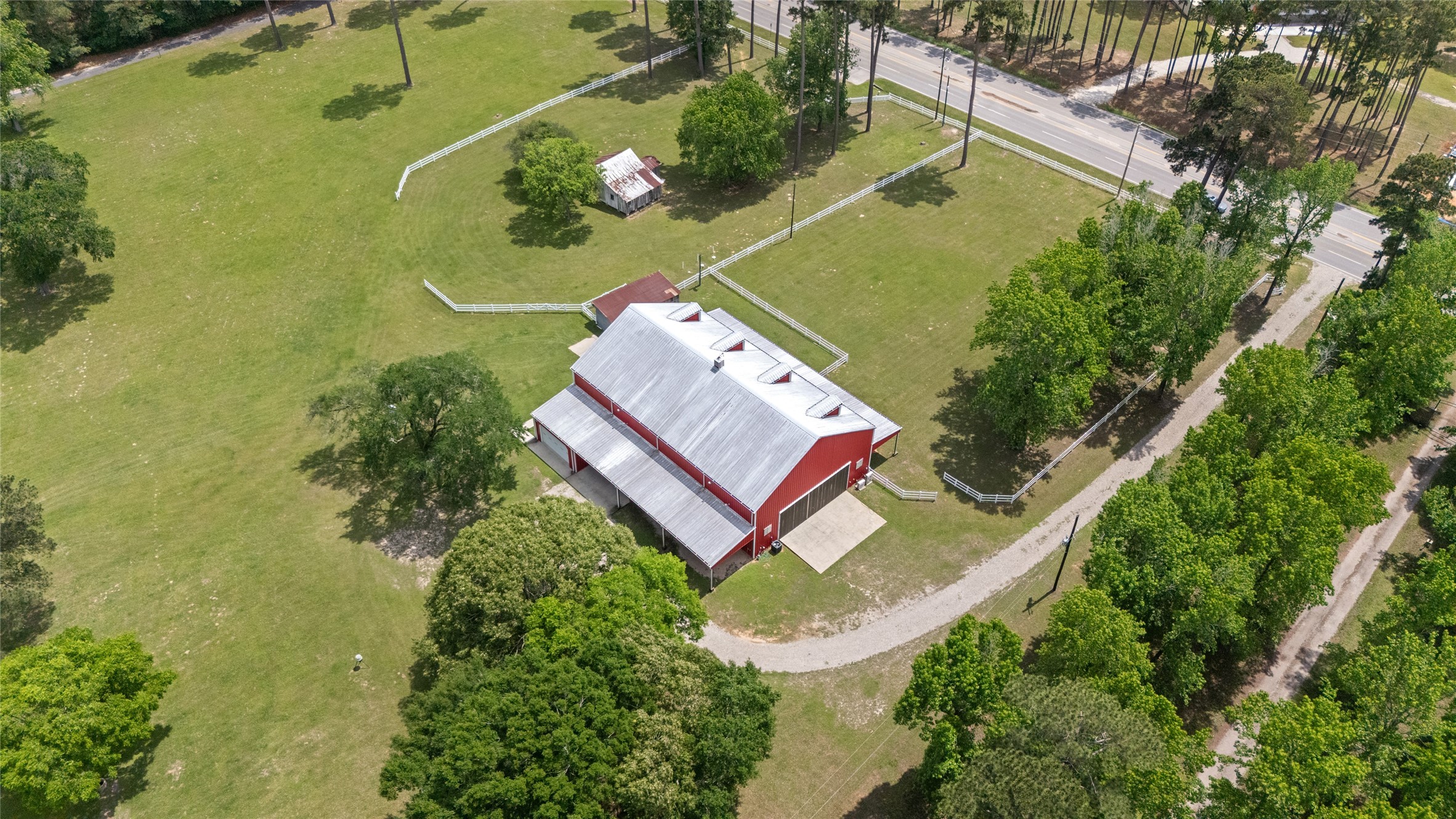 15126 Walden Road Montgomery, TX 77356 - Photo 7 of 50 Impressive view of the 10,000 square foot barndominium at the front of the property-versatile living space perfect as a primary residence or a guest house.