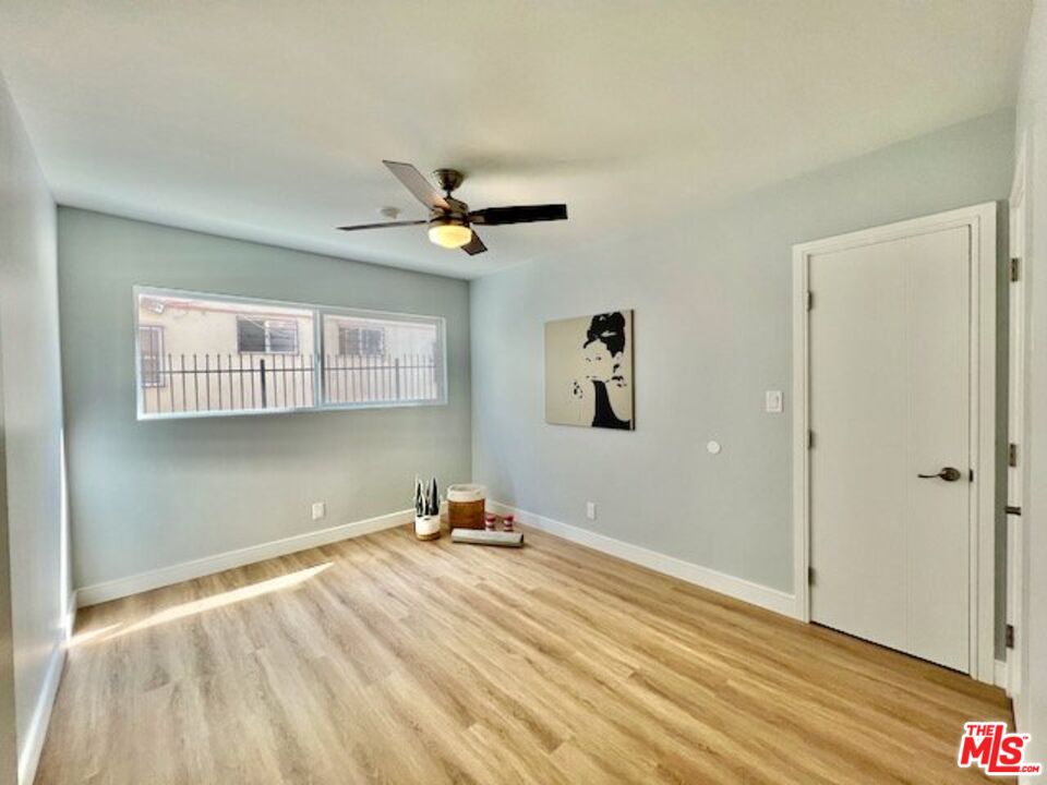 2012 South Bedford Street, Unit 1 Los Angeles, CA 90034 - Photo 12 of 17 a view of a room with wooden floor and window