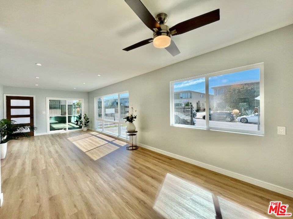 2012 South Bedford Street, Unit 1 Los Angeles, CA 90034 - Photo 15 of 17 a view of livingroom with window and wooden floor
