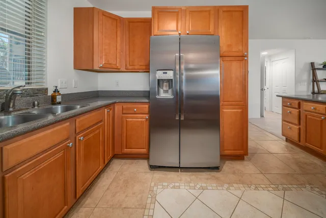a kitchen with stainless steel appliances granite countertop a stove and a microwave
