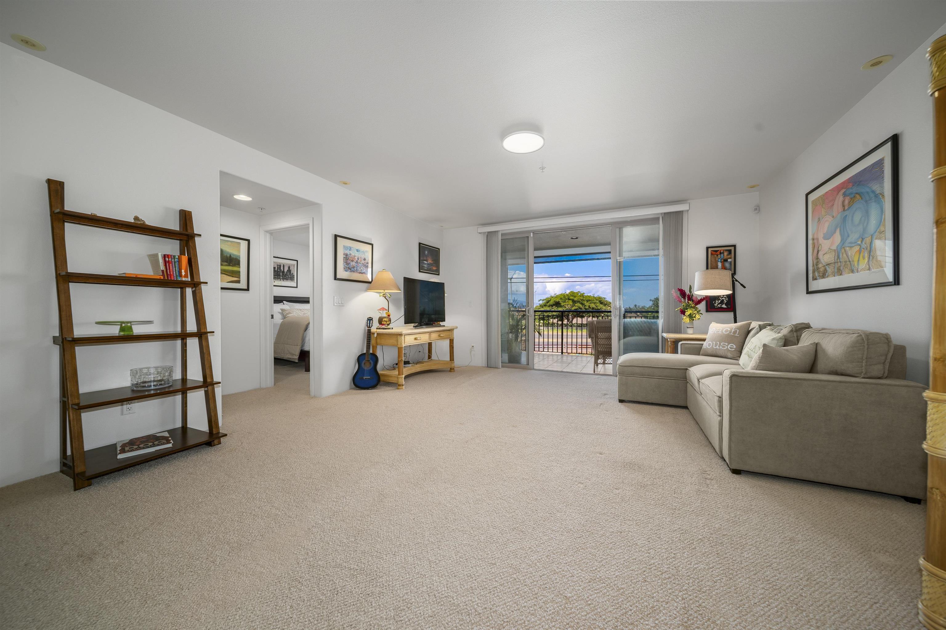 1233 Limahana Circle, Unit B202 Lahaina, HI 96761 - Photo 3 of 30 a living room with furniture and a large window