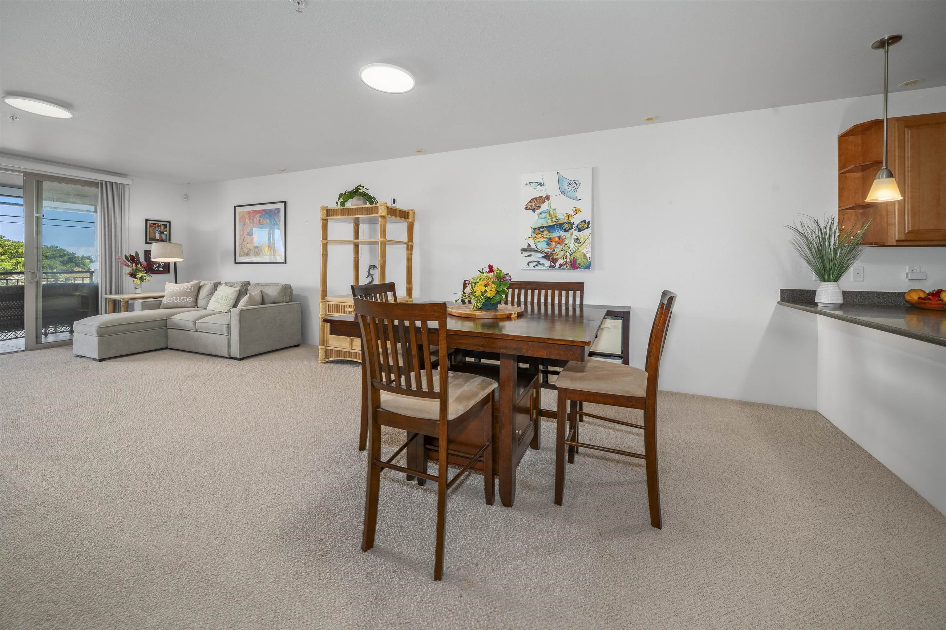 1233 Limahana Circle, Unit B202 Lahaina, HI 96761 - Photo 9 of 30 a dining room with furniture and a flat screen tv