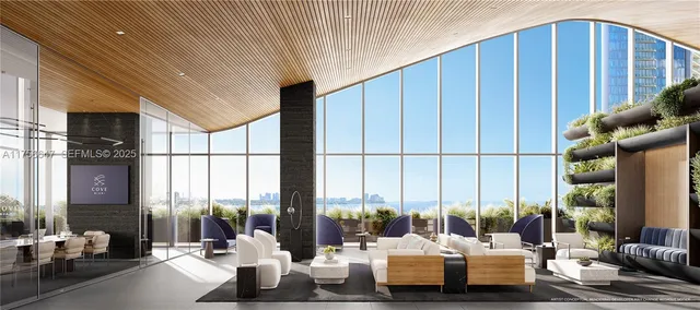 a living room with furniture and large windows