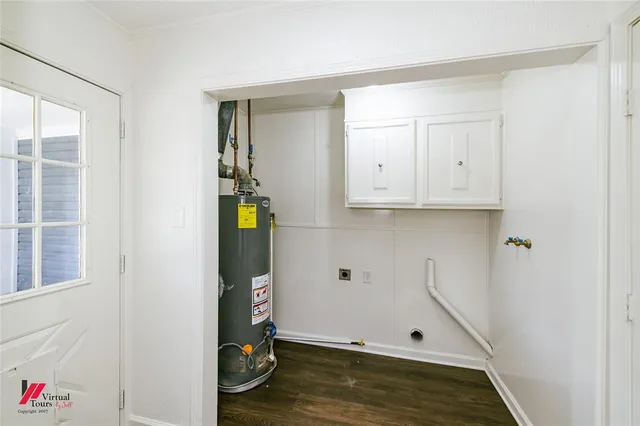 a view of storage and utility room with wooden floor