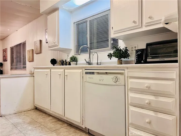a kitchen with stainless steel appliances a refrigerator and a stove