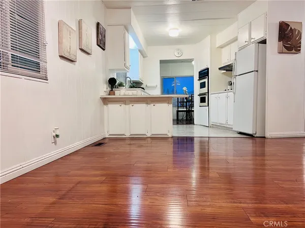 a workspace with furniture and wooden floor