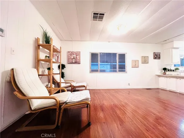 a workspace with furniture hardwood and a window