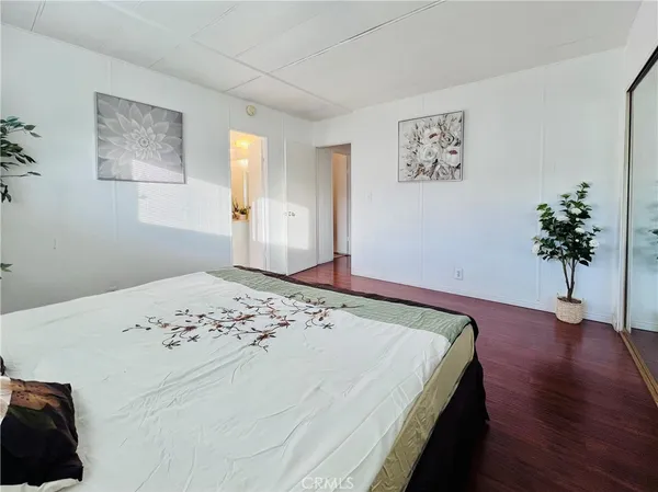a bathroom with a granite countertop bathtub shower and toilet