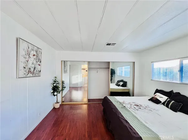 a spacious bathroom with a shower sink and mirror