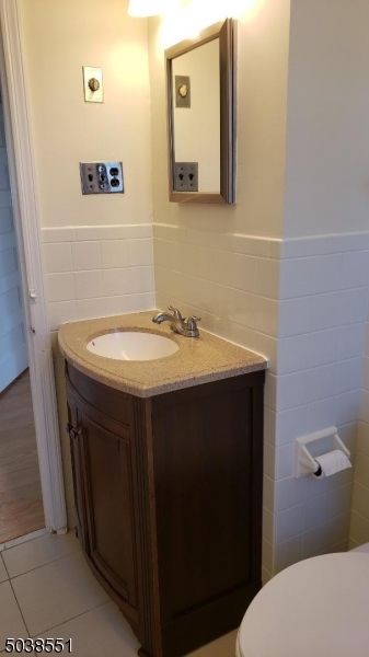 16 Munn Street, Unit 1 Montclair, NJ 07042 - Photo 16 of 22 a bathroom with a sink and a toilet