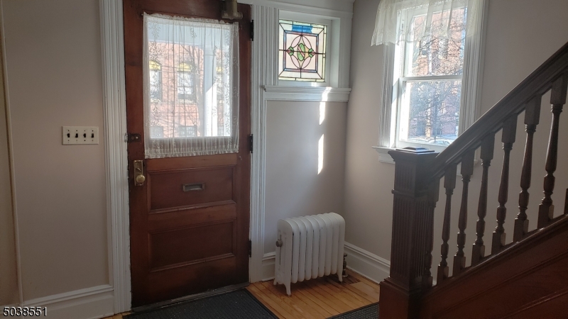 16 Munn Street, Unit 1 Montclair, NJ 07042 - Photo 19 of 22 a living room with furniture and a window