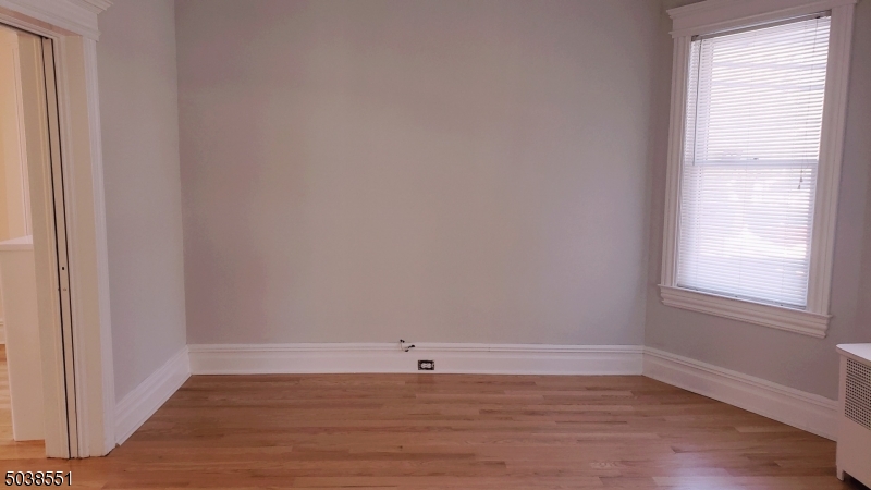 16 Munn Street, Unit 1 Montclair, NJ 07042 - Photo 5 of 22 a view of a small space with wooden floor and a window