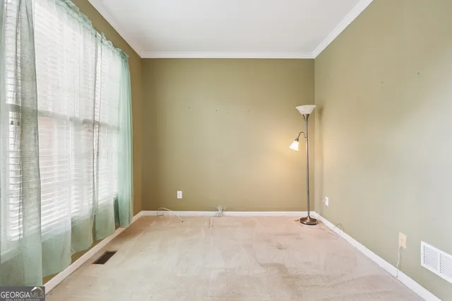 a view of a big room with windows