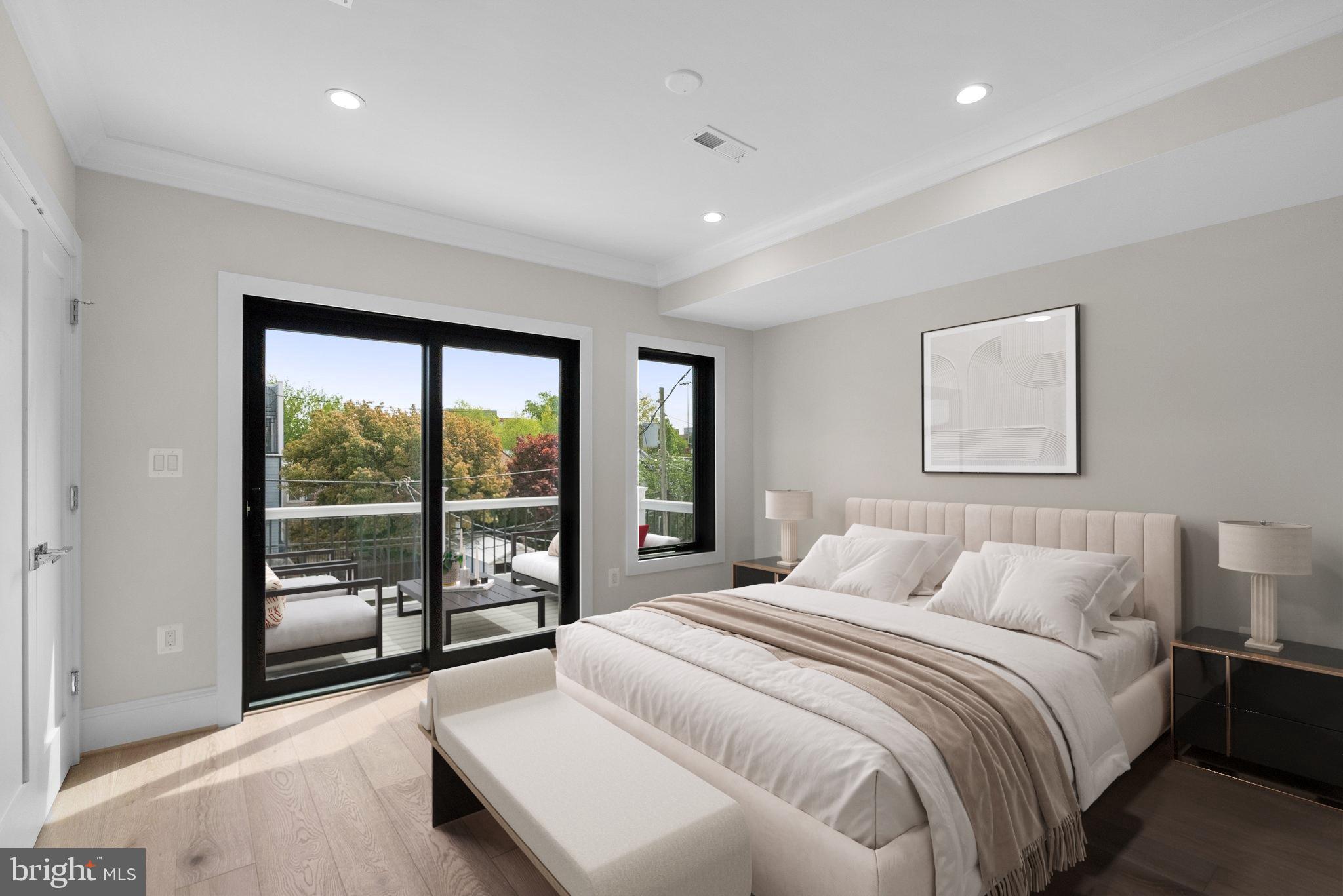 3710 S Street Northwest Washington, DC 20007 - Photo 12 of 32 a bedroom with a large bed and a large window