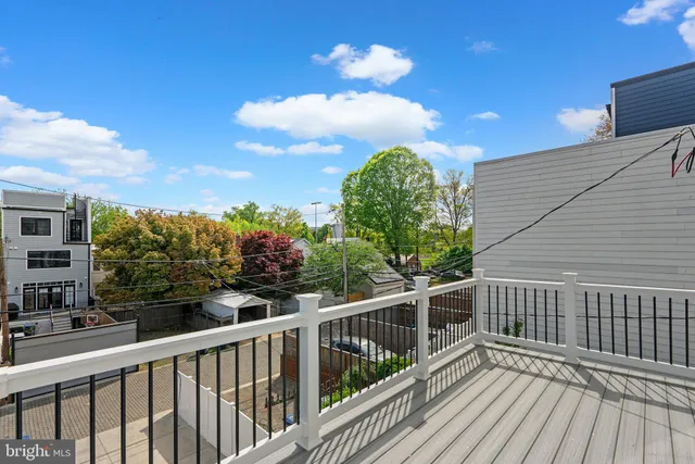 a view of a balcony with wooden floor
