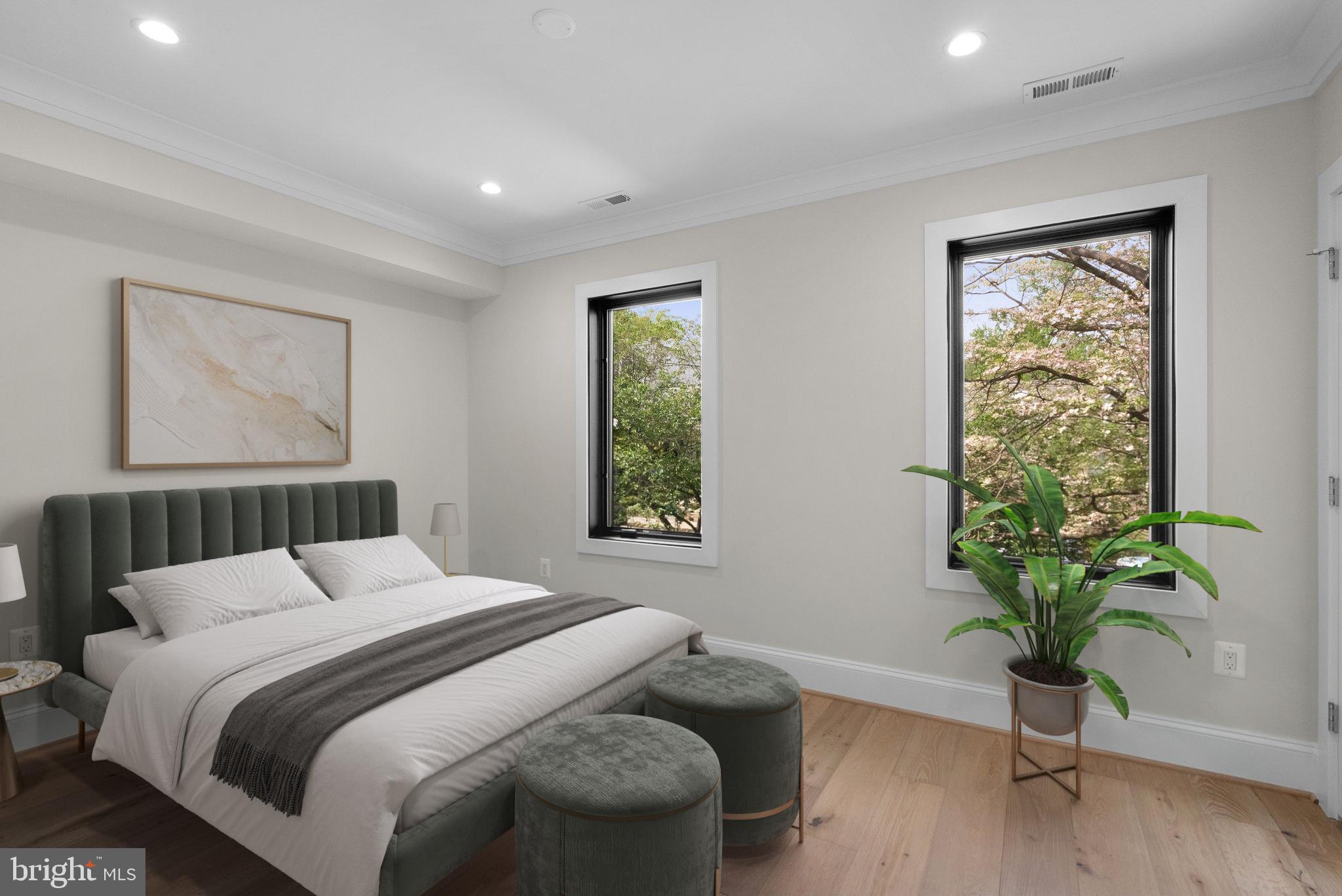 3710 S Street Northwest Washington, DC 20007 - Photo 17 of 32 a bedroom with a bed and a potted plant
