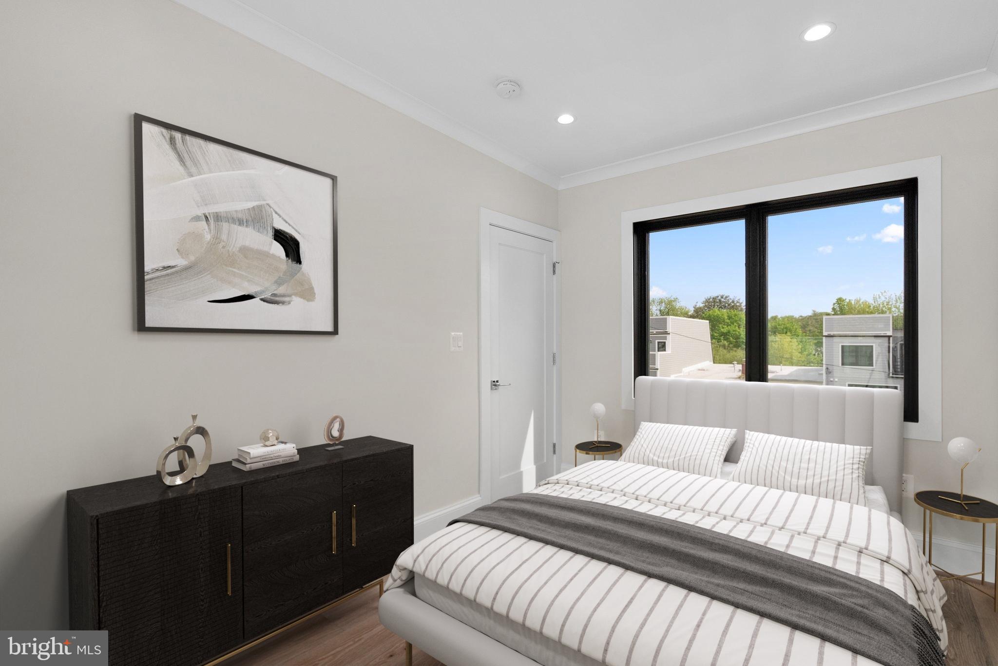 3710 S Street Northwest Washington, DC 20007 - Photo 20 of 32 a bedroom with a bed and a window