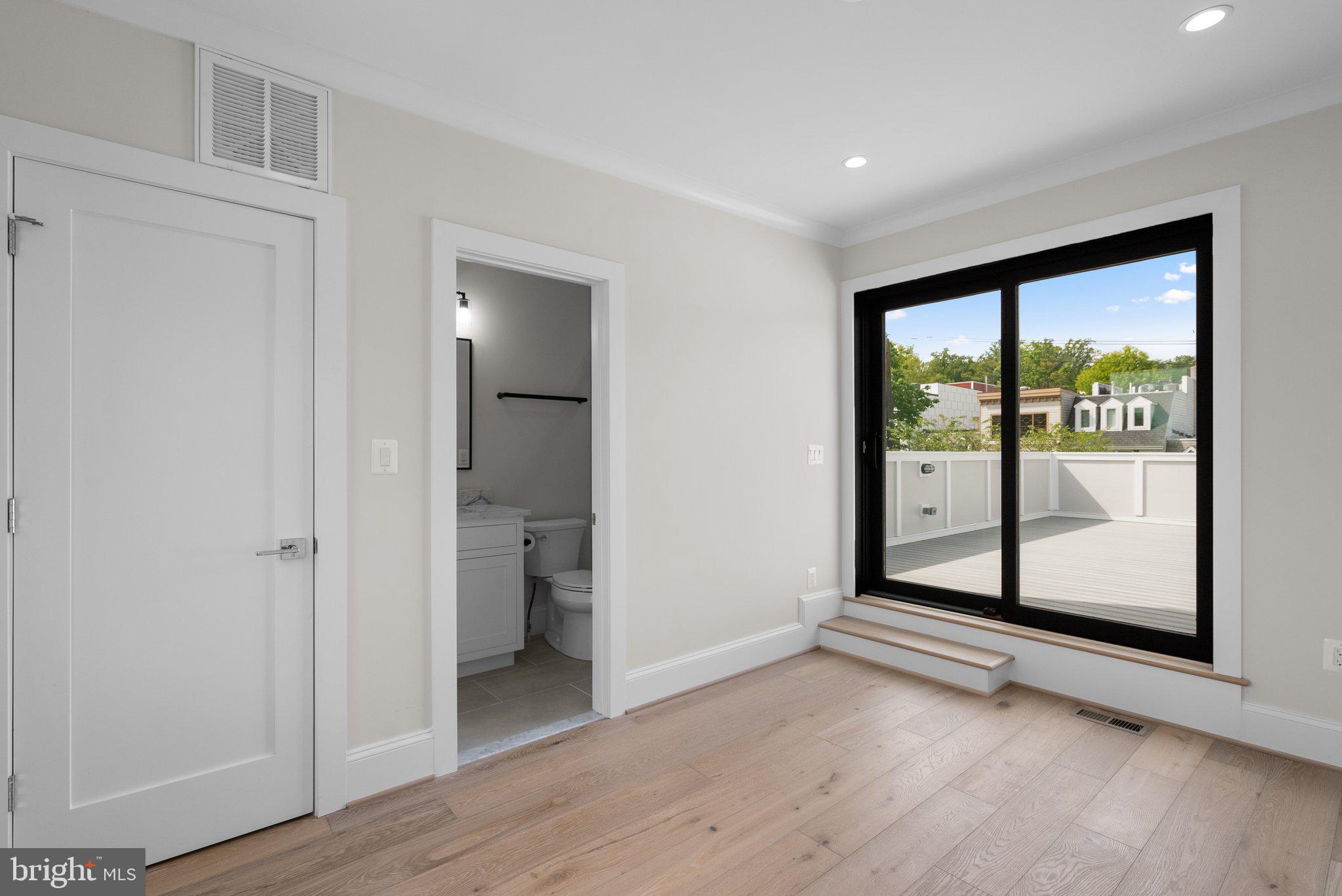3710 S Street Northwest Washington, DC 20007 - Photo 22 of 32 a view of a big room with wooden floor and windows