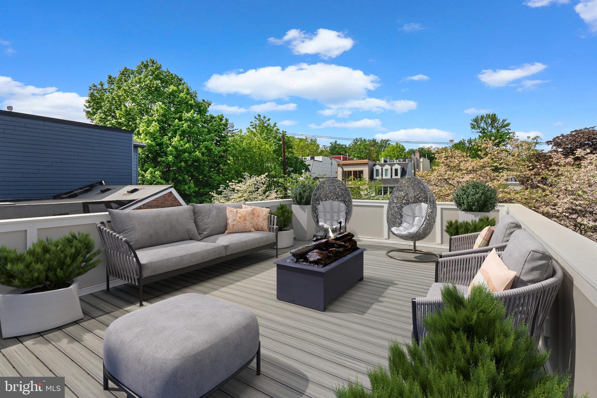 3710 S Street Northwest Washington, DC 20007 - Photo 24 of 32 a view of a roof deck with couches and sky view