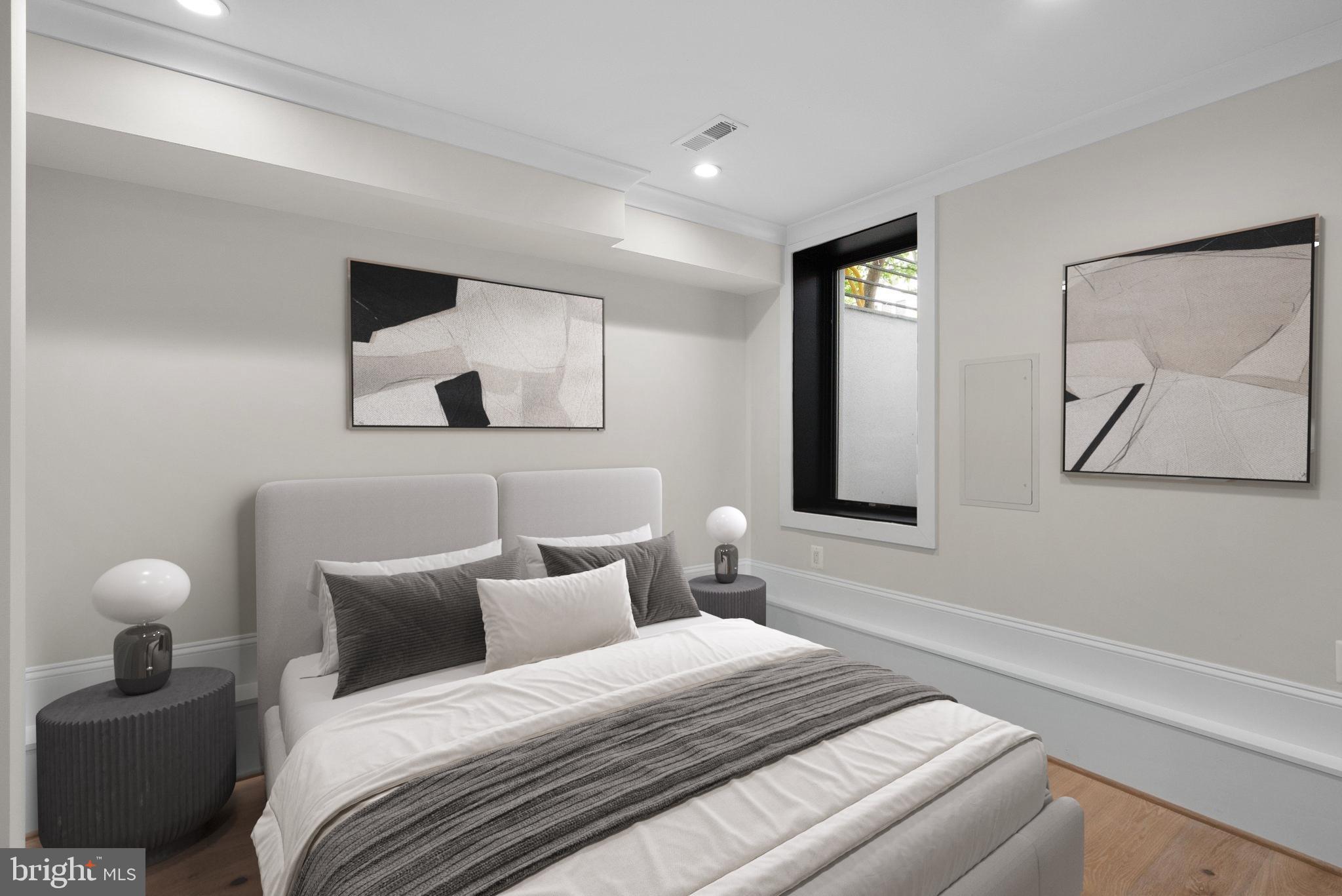 3710 S Street Northwest Washington, DC 20007 - Photo 27 of 32 a bedroom with a bed and a painting on the wall