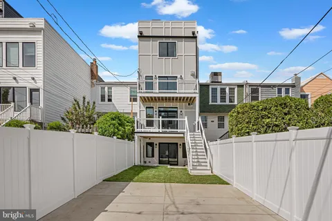 a front view of a house with yard