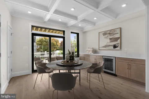 a view of a dining room with furniture wooden floor and a rug