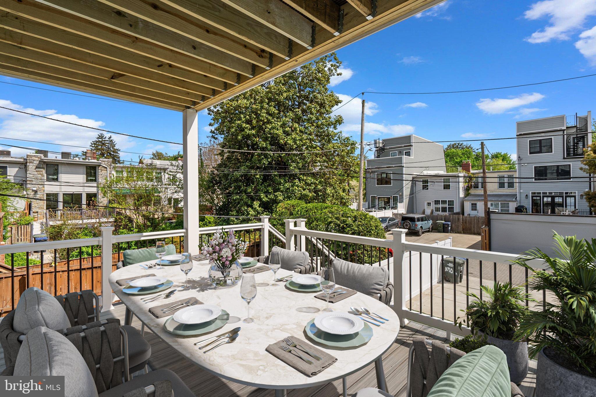 3710 S Street Northwest Washington, DC 20007 - Photo 10 of 32 a view of a balcony dining table and chairs