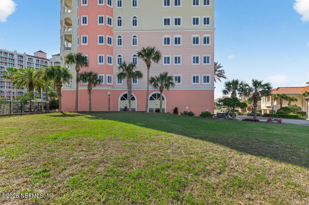 320 Ocean Crest Drive Palm Coast, FL 32137 - Photo 12 of 93 a front view of a building with garden