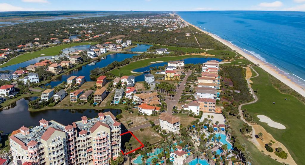 320 Ocean Crest Drive Palm Coast, FL 32137 - Photo 27 of 93 an aerial view of a house with a lake view