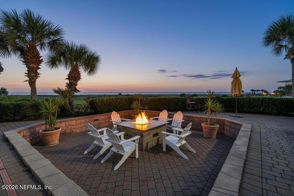 320 Ocean Crest Drive Palm Coast, FL 32137 - Photo 3 of 93 an outdoor sitting area with furniture and wooden floor