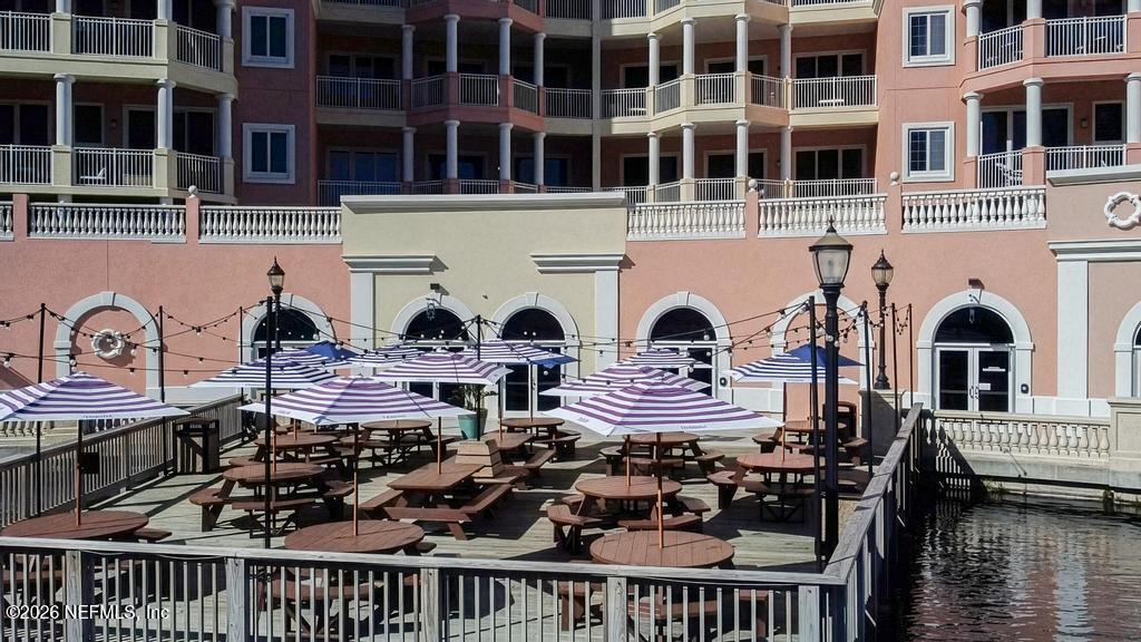 320 Ocean Crest Drive Palm Coast, FL 32137 - Photo 42 of 93 a front view of a house with balcony and sitting area