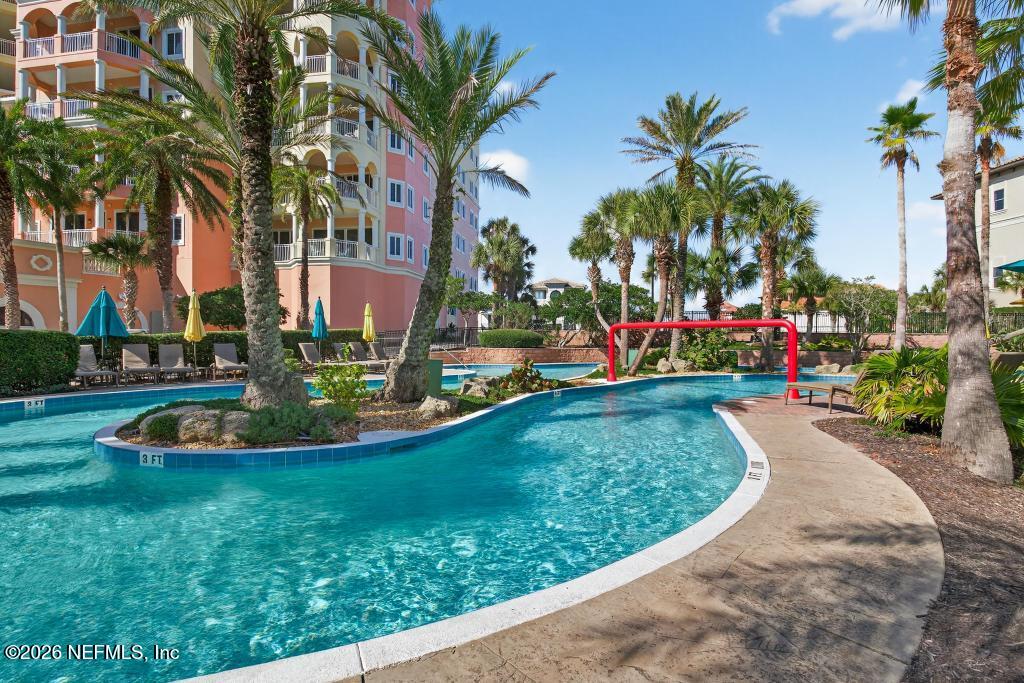 320 Ocean Crest Drive Palm Coast, FL 32137 - Photo 49 of 93 a view of a garden with palm trees