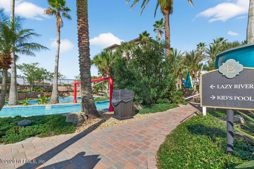 320 Ocean Crest Drive Palm Coast, FL 32137 - Photo 51 of 93 a view of a street with a sign on the side of it