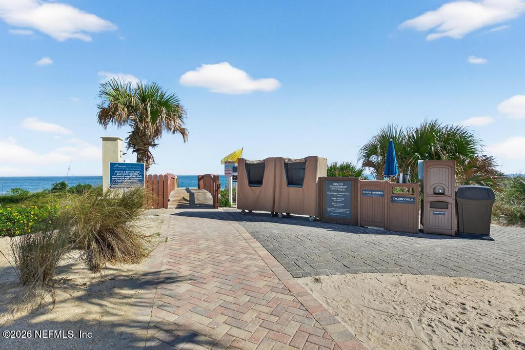 320 Ocean Crest Drive Palm Coast, FL 32137 - Photo 73 of 93 a view of a house with a yard and potted plants