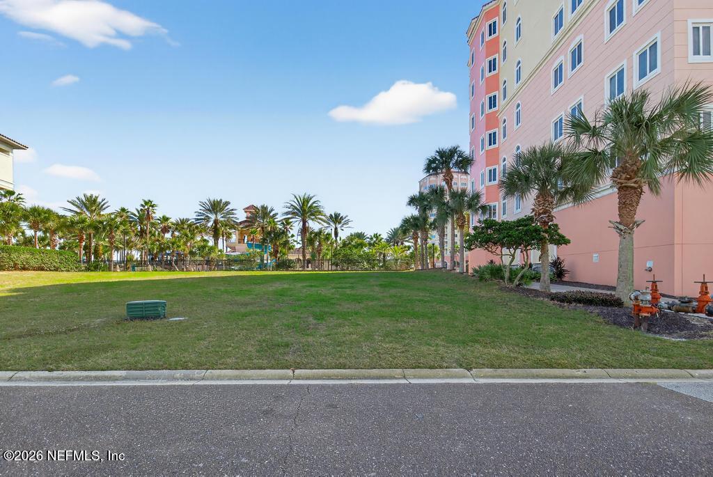 320 Ocean Crest Drive Palm Coast, FL 32137 - Photo 8 of 93 a front view of a house with a garden