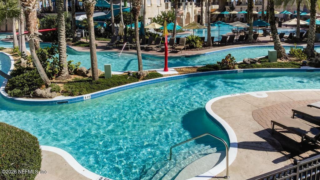 320 Ocean Crest Drive Palm Coast, FL 32137 - Photo 92 of 93 a view of a garden with lawn chairs