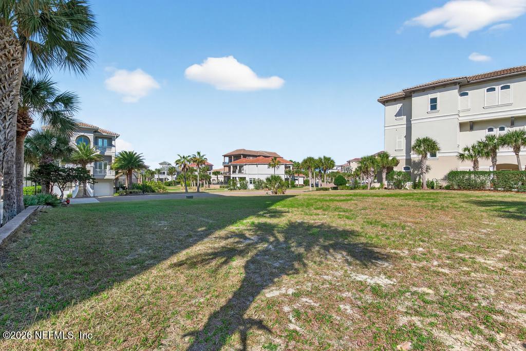 320 Ocean Crest Drive Palm Coast, FL 32137 - Photo 10 of 93 a view of building with outdoor space