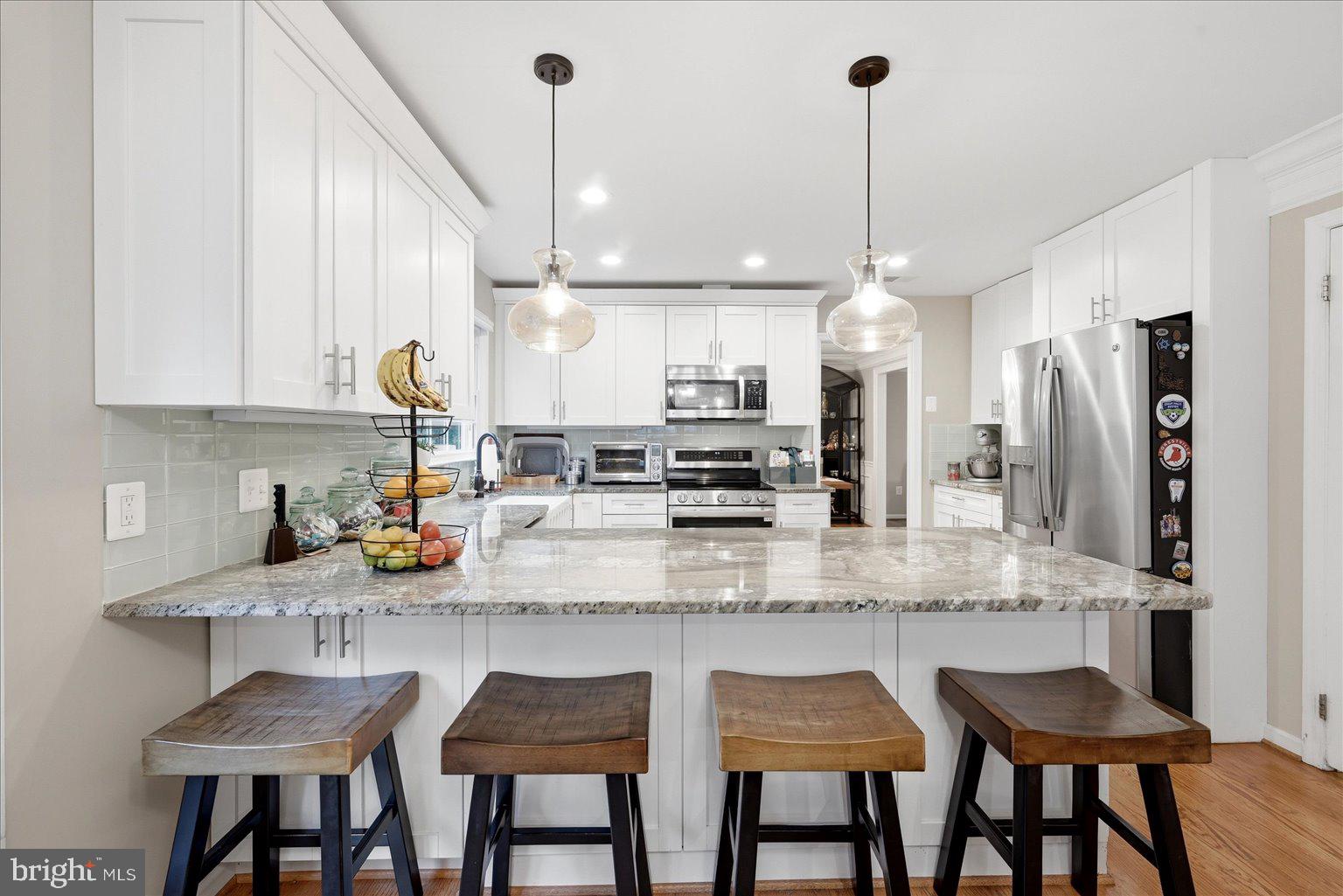 911 Riva Ridge Drive Great Falls, VA 22066 - Photo 13 of 55 Modern kitchen with stylish island.