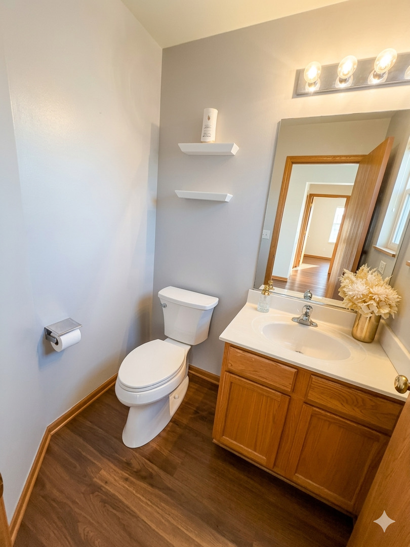 966 Forest View Way Antioch, IL 60002 - Photo 9 of 23 a bathroom with a granite countertop toilet sink and mirror